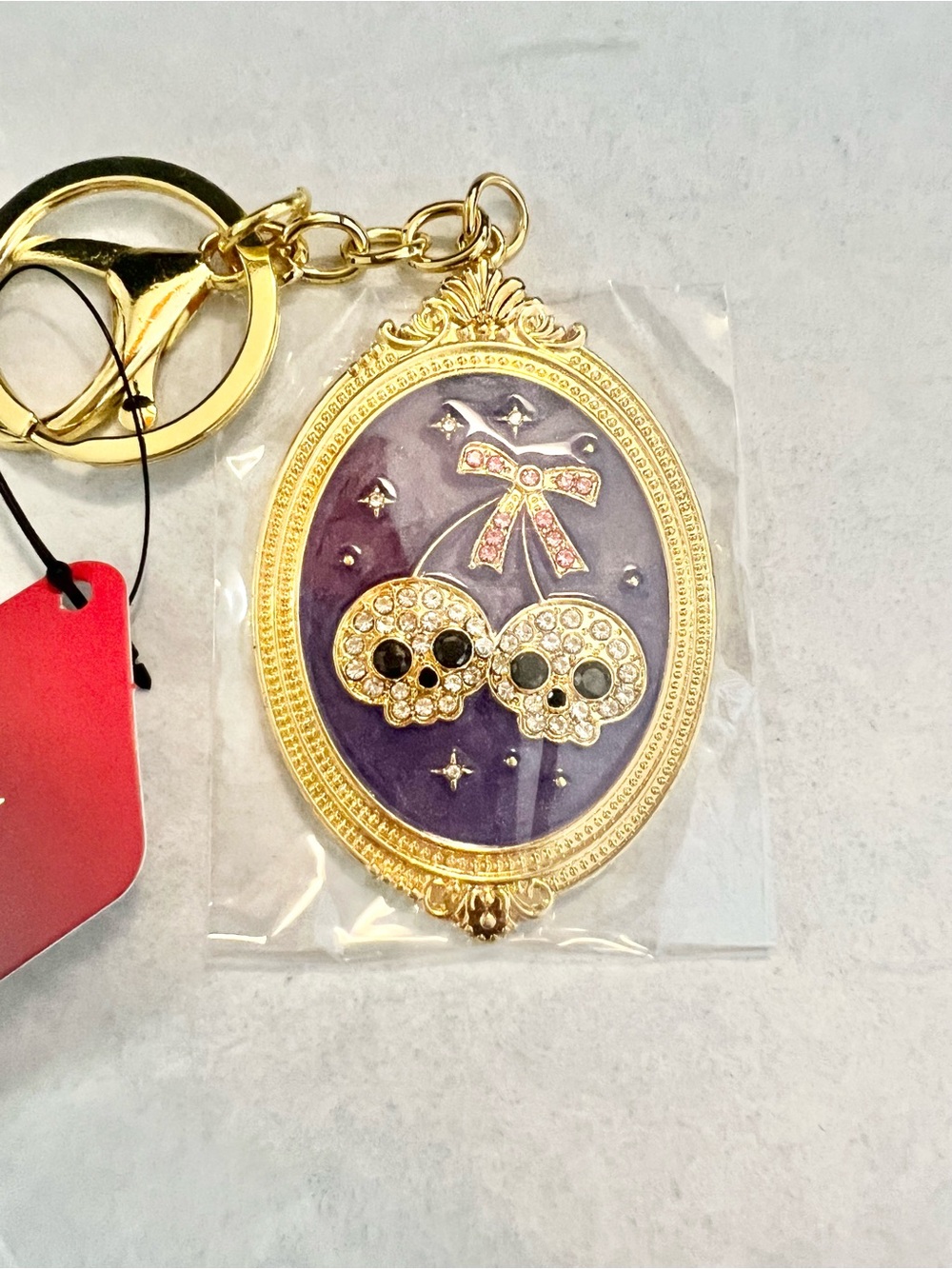Gold-Toned Frame Skull Cherry Keychain - Purple NWT